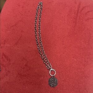 Elegant Silver Spiral Pendant Necklace
Diamond clasp and diamonds on pendent